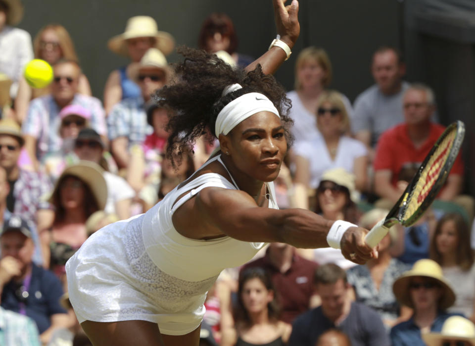 Serena Williams of the United States returns a shot to Garbine Muguruza of Spain during the women's singles final at the All England Lawn Tennis Championships in Wimbledon, London, Saturday July 11, 2015. (Sean Dempsey/Pool Photo via AP)