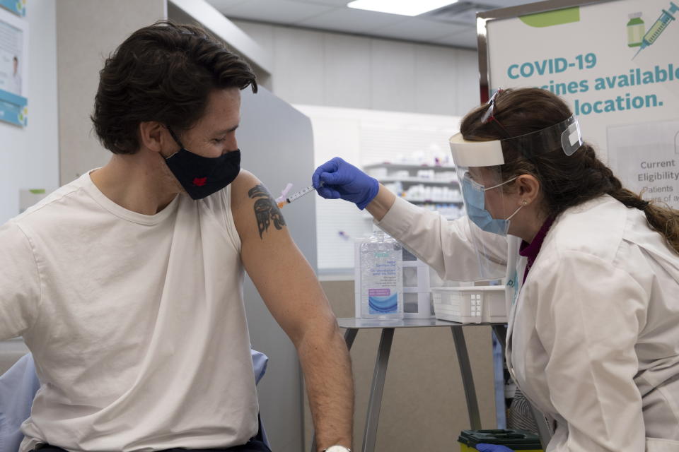 Prime Minister Justin Trudeau receives his first COVID-19 AstraZeneca vaccination in Ottawa on Friday April 23, 2021. (Adrian Wyld/The Canadian Press via AP)