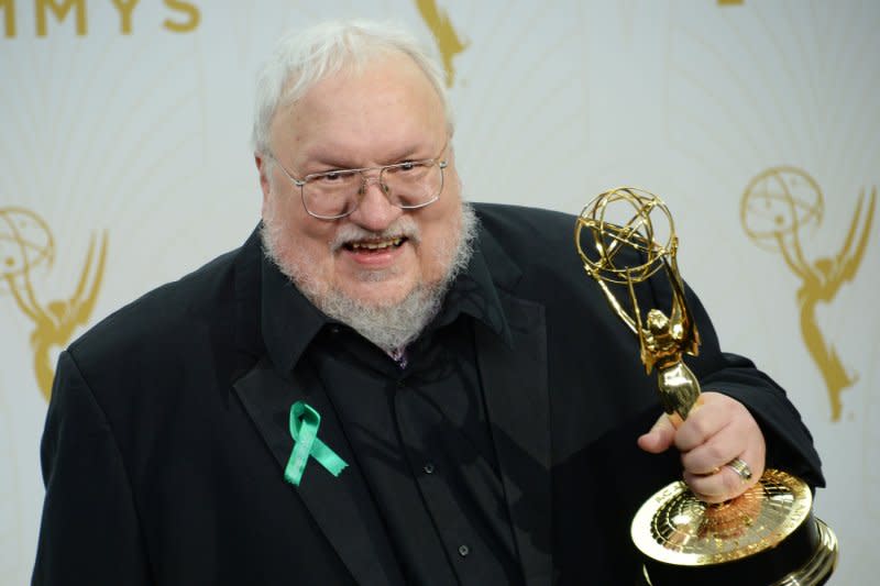 George R. R. Martin, winner of Outstanding Drama Series for "Game of Thrones" holds his Emmy at the Primetime Emmy Awards in the Microsoft Theater in Los Angeles in 2015. File Photo by Jim Ruymen/UPI