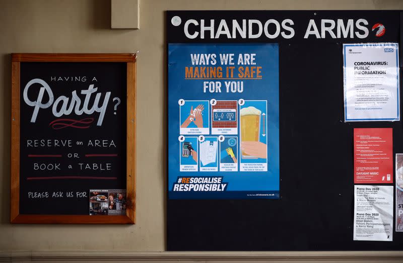 A safety sign is seen on a notice board in the Chandos Arms pub ahead of pubs reopening following the coronavirus disease (COVID-19) outbreak, in London