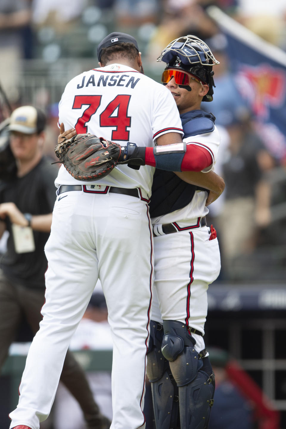 Atlanta Braves catcher William Contreras, right, and Kenley Jansen (74) embrace in the ninth inning of a baseball game against the Pittsburgh Pirates, Sunday, June 12, 2022, in Atlanta. (AP Photo/Hakim Wright Sr.)