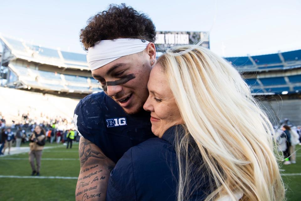 Penn State senior tight end Theo Johnson hugs his mom, Amy Johnson, following the Lions' Senior Day victory over Rutgers. She and her six boys escaped a decade of abuse from her ex-husband, year earlier. "My gratitude just focuses on the fact they didn’t make excuses," she said of her sons. "I'm thankful we worked at this together. We all had plenty of reasons and opportunities to feel sorry for ourselves and get up in the morning and not try our best and fall through the cracks and we didn’t do that. I'm genuinely thankful we rose above that."