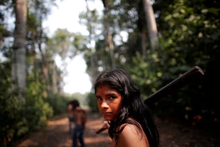 An Indigenous from the Mura tribe reacts in front of a deforested area in nondemarcated indigenous land inside the Amazon rainforest near Humaita
