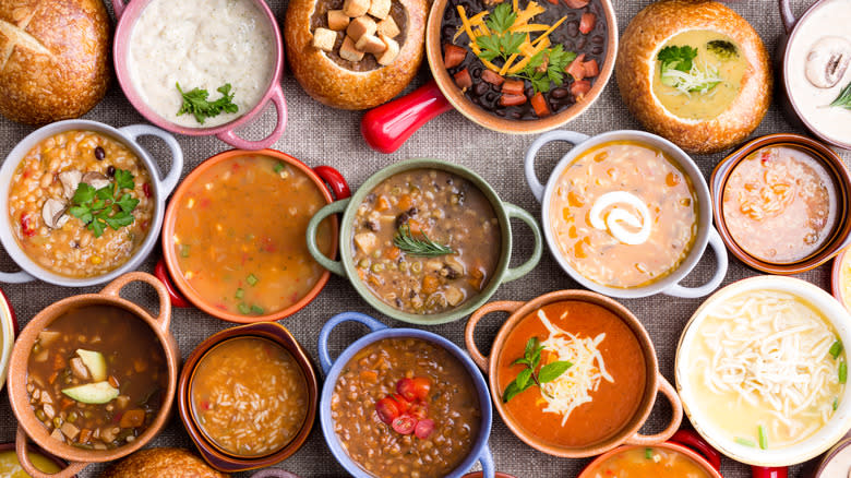 Multiple bowls of colorful soups