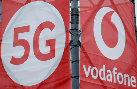 FILE PHOTO: Logos of 5G technology and telecommunications company Vodafone are pictured at the 5G Mobility Lab of Vodafone in Aldenhoven, Germany, November 27, 2018.REUTERS/Thilo Schmuelgen/File Photo