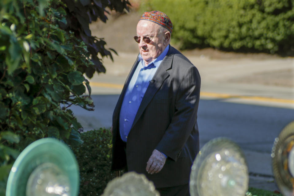 Judah Samet walks around the Tree of Life Synagogue, Thursday, Oct. 24, 2019 in the Squirrel Hill neighborhood of Pittsburgh. Samet, a holocaust survivor, was in the parking lot of the synagogue last year, when a gunman entered the building and opened fire, killing 11 and wounding seven. Sunday, Oct. 27, marks the one-year anniversary of the deadliest attack on Jews in U.S. history. A virtual remembrance, an overseas concert and community service projects highlight the many plans for commemorating the loss. (AP Photo/Keith Srakocic)