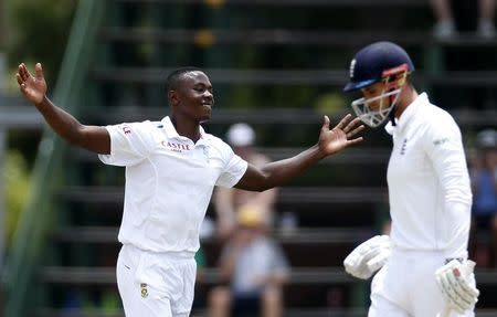 South Africa's Kagiso Rabada (L) celebrates the dismissal of England's Alex Hales after he was caught out by AB de Villiers during the third cricket test match in Johannesburg, South Africa, January 15, 2016.REUTERS/Siphiwe Sibeko