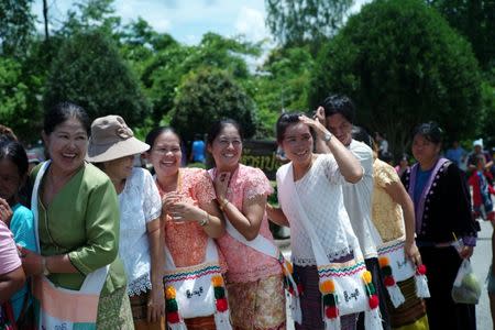 Ethnic minorities line up at a temple fair, in the northern province of Chiang Rai, Thailand July 13, 2018. Picture taken July 13, 2018. REUTERS/Panu Wongcha-um