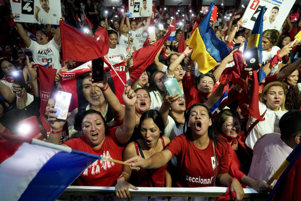 Followers of Santiago Peña, presidential candidate of the Colorado party, attend a political rally in Asuncion, Paraguay, Monday, April 24, 2023. Paraguay's general elections are scheduled for April 30. (AP Photo/Jorge Saenz)