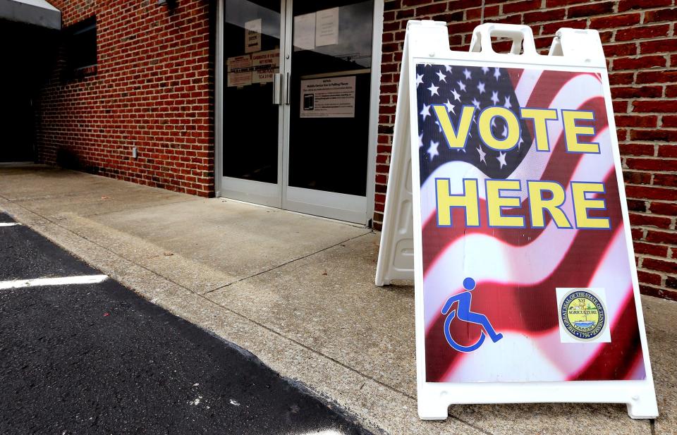 This "VOTE HERE' signs is by the rear entrance of Smyrna Town Hall, which is one of seven early voting polling locations offered by the Rutherford County Election Commission. E2016.