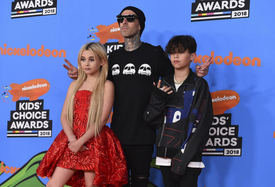 Travis Barker, center, and his children Alabama Barker, left, and Landon Barker arrive at the Kids' Choice Awards at The Forum on Saturday, March 24, 2018, in Inglewood, Calif. (Photo by Jordan Strauss/Invision/AP)