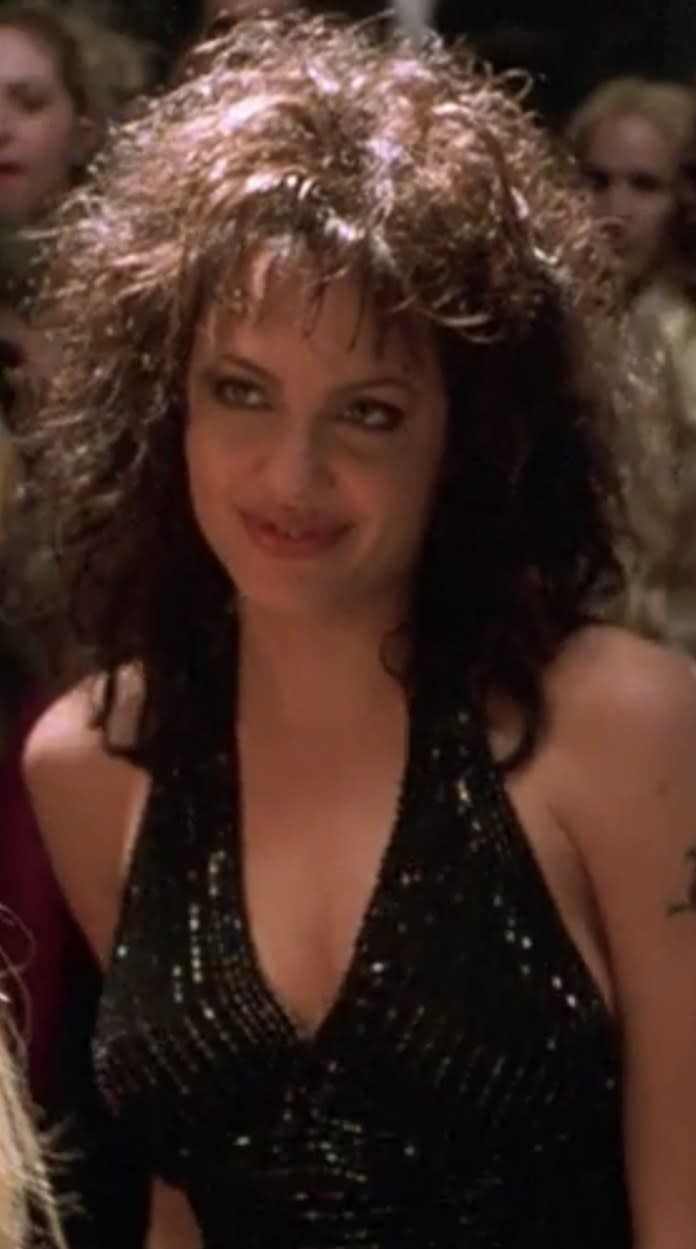 Jolie in a halter dress with curly hair