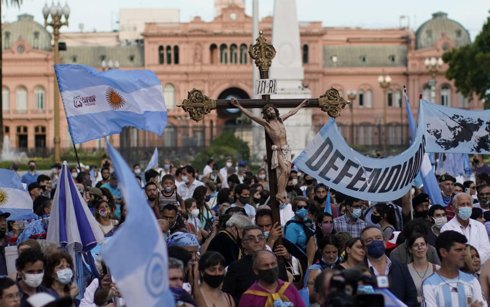 Activists against abortion gather at Plaza de Mayo to protest against the decriminalization of abortion, one day before lawmakers will debate its legalization, in Buenos Aires, Argentina, Monday, Dec. 28, 2020. (AP Photo/Victor R. Caivano)