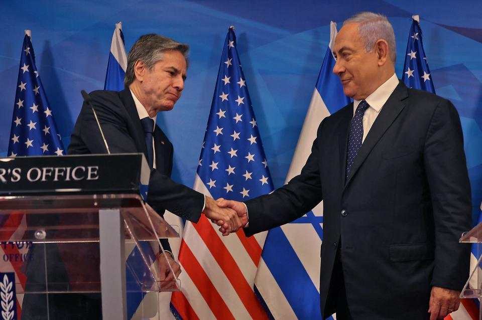 Israeli Prime Minister Benjamin Netanyahu and U.S. Secretary of State Antony Blinken shake hands during a joint press conference in Jerusalem, May 25, 2021, days after an Egypt-brokered truce halted fighting between Israel and Hamas. / Credit: MENAHEM KAHANA/AFP/Getty