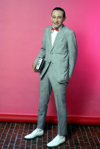 <p>Michael Ochs Archives/Getty</p> Paul Reubens as Pee-wee Herman in 1980.