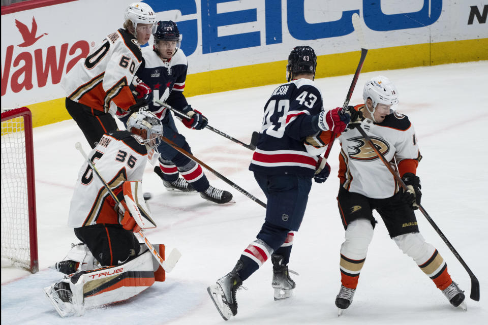 Anaheim Ducks goaltender John Gibson (36) blocks the puck with his body during the third period of the team's NHL hockey game against the Washington Capitals on Tuesday, Jan. 16, 2024, in Washington. (AP Photo/Manuel Balce Ceneta)