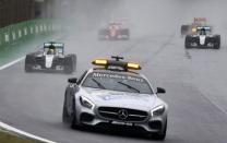 Formula One - F1 - Brazilian Grand Prix - Circuit of Interlagos, Sao Paulo, Brazil - 13/11/2016 - Mercedes' Lewis Hamilton of Britain (L) follows the safety car at the start of the race. REUTERS/Nacho Doce