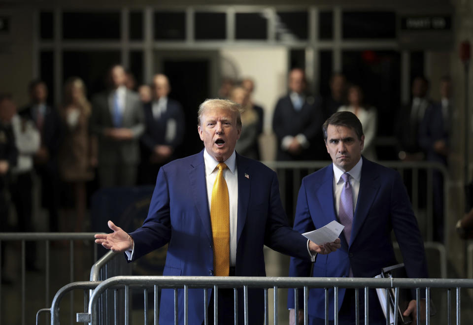 Former President Donald Trump speaks to the press with attorney Todd Blanche at his trial at the Manhattan Criminal court, Tuesday, May 7, 2024 in New York. (Win McNamee/Pool Photo via AP)