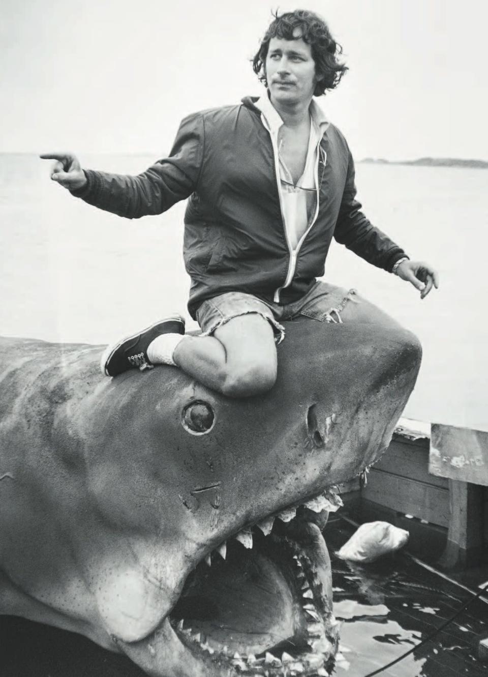Steven Spielberg rides a mechanical shark during the making of "Jaws."