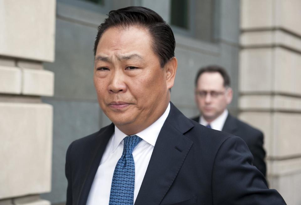 Stephen Kim, a former State Department expert on North Korea, leaves federal court in Washington, Wednesday, April 2, 2014, after a federal judge sentenced him to 13 months in prison for passing classified information to a journalist. (AP Photo/Cliff Owen)