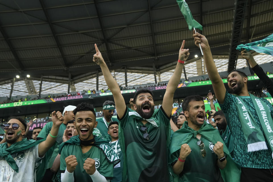 Saudi Arabia fans cheer prior of the World Cup group C soccer match between Poland and Saudi Arabia, at the Education City Stadium in Al Rayyan , Qatar, Saturday, Nov. 26, 2022. (AP Photo/Francisco Seco)