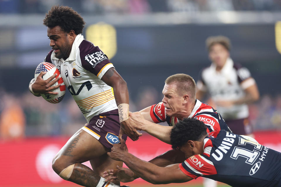 LAS VEGAS, NEVADA - MARCH 02: Ezra Mam of the Broncos is tackled during the round one NRL match between Sydney Roosters and Brisbane Broncos at Allegiant Stadium, on March 02, 2024, in Las Vegas, Nevada. (Photo by Ezra Shaw/Getty Images)