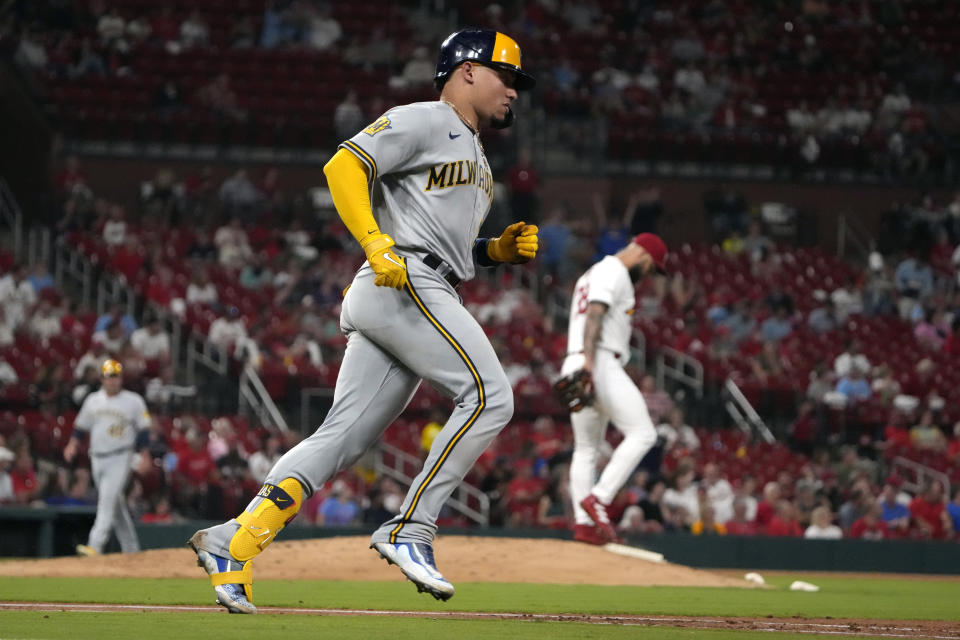 Milwaukee Brewers' William Contreras, left, rounds the bases after hitting a solo home run off St. Louis Cardinals starting pitcher Drew Rom during the third inning of a baseball game Tuesday, Sept. 19, 2023, in St. Louis. (AP Photo/Jeff Roberson)