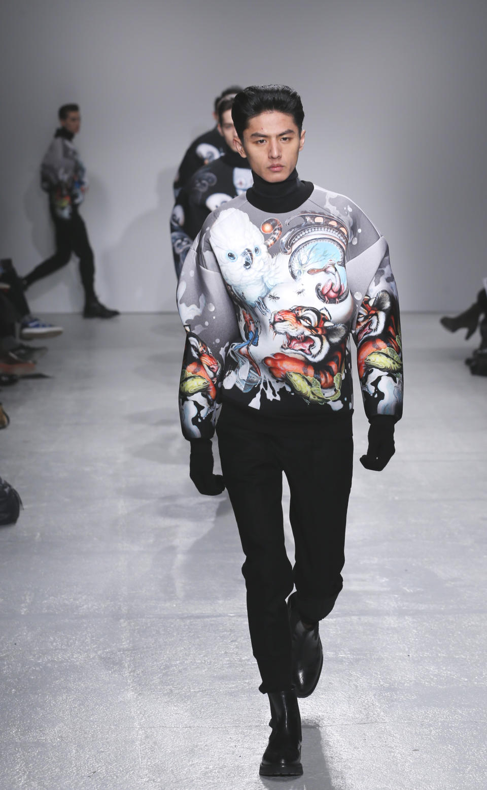 A model wears a creation by South Korean fashion designer Juun. J as part of his presentation for Men's 2013 fall-winter 2013/2014 men's fashion collection, presented in Paris, Friday, Jan.18, 2013. (AP Photo/Jacques Brinon)