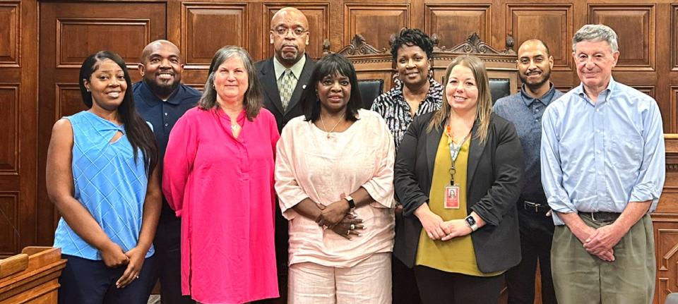 Akron Citizens' Police Oversight Board members, from left: Tristan Reed, Chair Kemp Boyd, Beverly Richards, Shawn Peoples, Vice Chair Donzella Anuszkiewicz, Diane Lewis, Cati Castle,  Brandyn Costa and Robert Gippin.