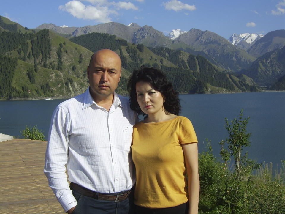 In this August 2009 photo provided by his family, Yalqun Rozi stands with his wife, Zaynap Ablajan, at Boghda Lake near Urumqi in the Xinjiang region of China. His family lives in exile in Philadelphia. (AP Photo/Yalqun Family)