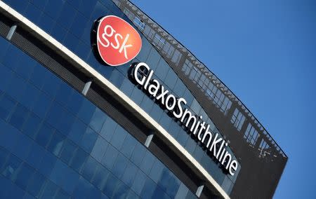 FILE PHOTO: Signage for GlaxoSmithKline is seen on its offices in London, Britain, March 30, 2016. REUTERS/Toby Melville/File Photo