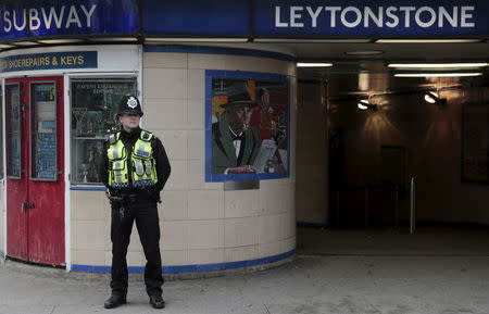 A police officer patrols outside Leytonstone Underground station in east London, Britain December 6, 2015. REUTERS/Suzanne Plunkett