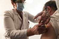 A patient is injected with the coronavirus vaccine at a clinic in Strasbourg, eastern France, Monday Jan. 4, 2021. (Jean-François Badias / AP)