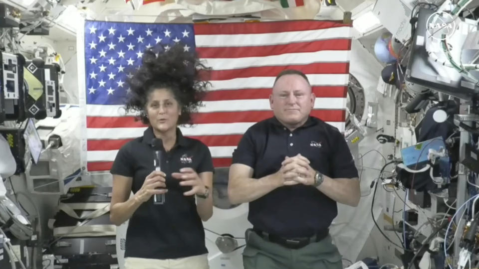 In this image from video provided by NASA, astronauts Suni Williams, left, and Butch Wilmore give a news conference aboard the International Space Station on Wednesday, July 10, 2024. (NASA via AP)