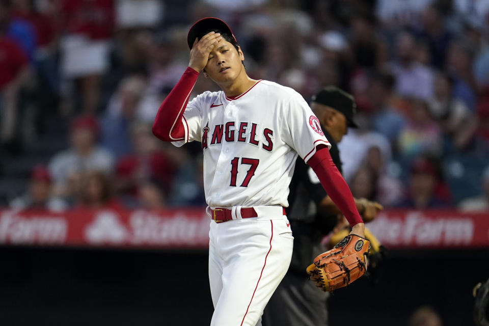 Los Angeles Angels' Shohei Ohtani reacts after giving up an RBI single to Seattle Mariners' J.P. Crawford during the third inning of a baseball game Monday, Aug. 15, 2022, in Anaheim, Calif. (AP Photo/Marcio Jose Sanchez)