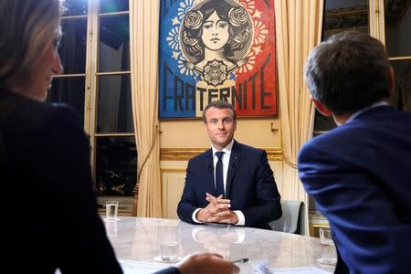 French President Emmanuel Macron is seen before his first long live television interview on prime time at the Elysee Palace in Paris, France, October 15, 2017. REUTERS/Philippe Wojazer