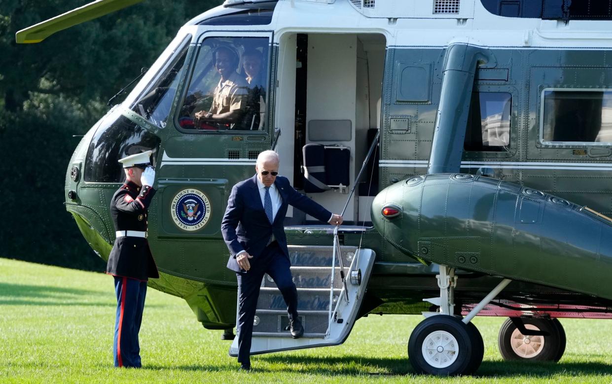 Joe Biden arrives on Marine One on the South Lawn of the White House