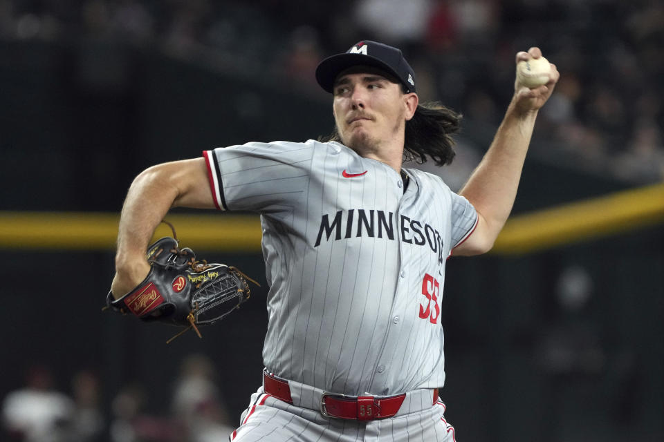 Minnesota Twins pitcher Kody Funderburk throws to an Arizona Diamondbacks batter during the ninth inning of a baseball game Thursday, June 27, 2024, in Phoenix. The Twins won 13-6. (AP Photo/Rick Scuteri)