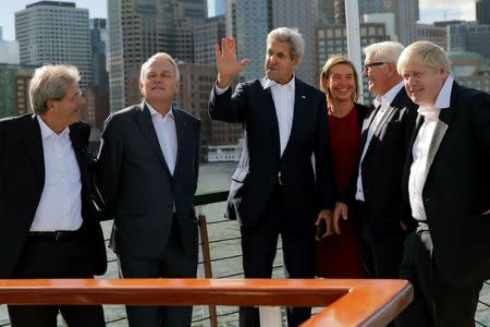 U.S. Secretary of State John Kerry talks to Italian Foreign Minister Paolo Gentiloni, French Foreign Minister Jean-Marc Ayrault, European Union High Representative Federica Mogherini, German Foreign Minister Frank-Walter Steinmeier and British Foreign Secretary Boris Johnson as they depart on a cruise through Boston Harbor in Boston, Massachusetts, U.S. September 24, 2016. REUTERS/Brian Snyder