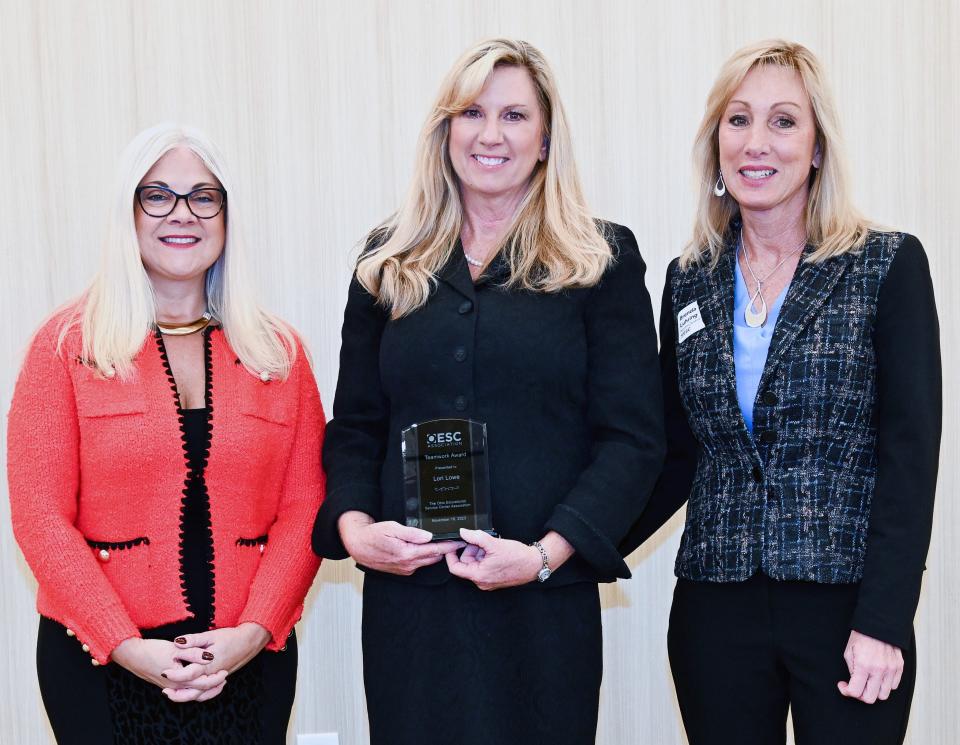 MVESC Superintendent Lori Snyder-Lowe (center) is honored by OESCA President Jennifer Felker and North Central Ohio ESC Superintendent Brenda Luhring for winning the Ohio Educational Service Center Association's Teamwork Award at the recent Ohio School Boards Association Capitol Conference in Columbus.