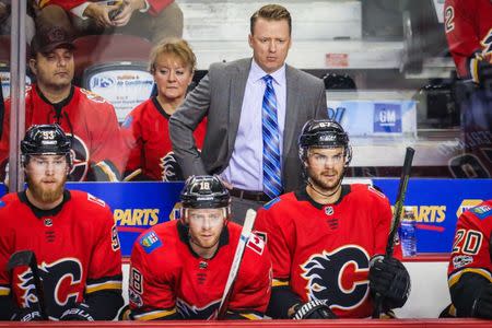 Oct 13, 2017; Calgary, Alberta, CAN; Calgary Flames head coach Glen Gulutzan on his bench against the Ottawa Senators during the first period at Scotiabank Saddledome. Mandatory Credit: Sergei Belski-USA TODAY Sports