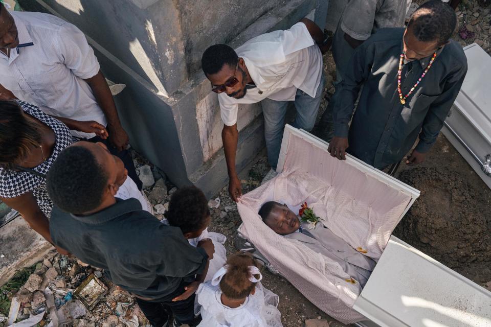 <br>The funeral of Denis’ children. “Barbecue is destroying everything,” Denis says. “He is a vampire, who feeds on blood.”