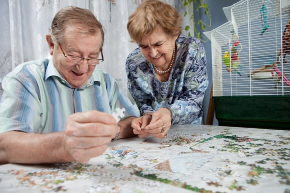 Senior couple doing a puzzle