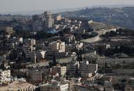 A general view shows the Israeli barrier at the Palestinian town of Abu Dis in the Israeli-occupied West Bank east of Jerusalem