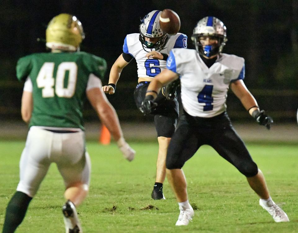 Bartram Trail's Liam Padron (6) punts the ball during first quarter action against Fleming Island.