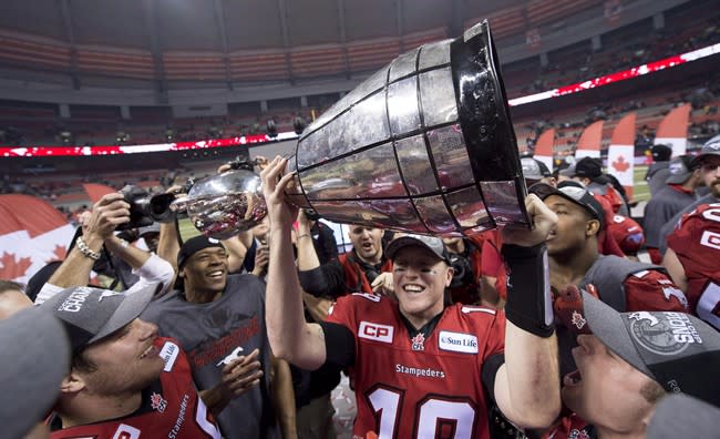 Bo Levi Mitchell (19) won the Grey Cup and the Grey Cup MVP award this season with the Stampeders, who have now extended him through 2018. (Nathan Denette/The Canadian Press.)