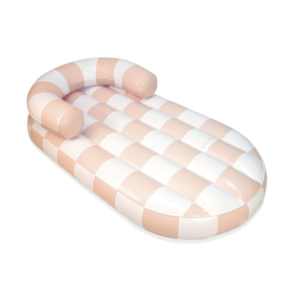 This image provided by Minnidip shows Minnidip's 3' x 5' Arched Checker chaise lounger. Blow it up and bob away the day on your favorite waterway. (Minnidip via AP)