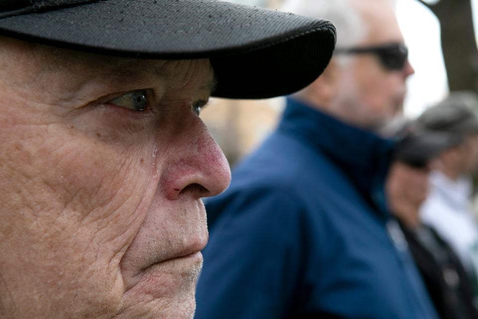 A tear rolls down the face of Larry Mitchell, 75 of Lancaster, as he listens to the names of Fairfield County natives who gave their lives in the Vietnam War are read. Mitchell served in the Army Fourth Infantry and served two tours in Vietnam in 1968 and 1969.