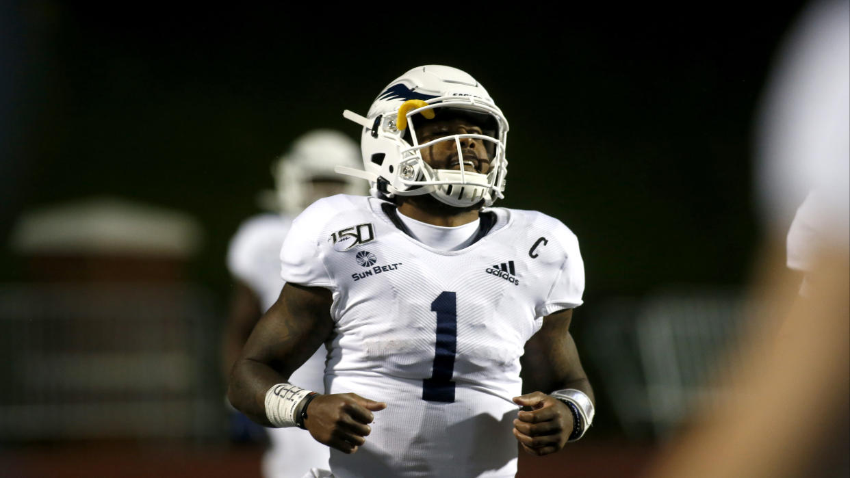 Georgia Southern quarterback Shai Werts (1) celebrates his touchdown during the second half of an NCAA college football game against Appalachian State Thursday, Oct. 31, 2019, in Boone, NC. (AP Photo/Brian Blanco)