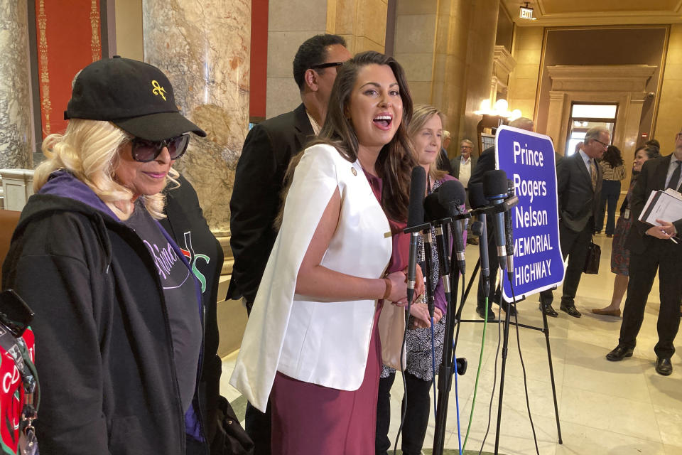 Minnesota Sen. Julia Coleman speaks to reporters at the Minnesota Capitol, Thursday, May 4, 2023, in St. Paul, Minn., after the Senate approved her bill to honor the late pop superstar Prince. The bill designates the highway that runs past his Paisley Park museum and studios in Chanhassen, Minn., as the Prince Rogers Nelson Memorial Highway. On the left is Prince’s oldest sister, Sharon Nelson. (AP Photo/Steve Karnowski)